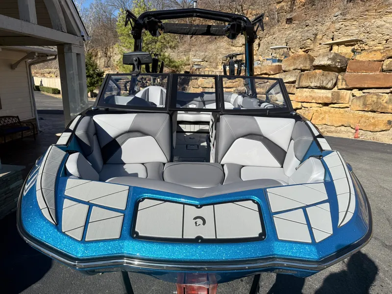 Slide: The Image of The image shows a 2026 Centurion Fe22 boat with blue and gray interior. - 6