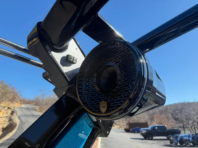Slide: The Image of Close-up of a speaker on a boat, with a blue sky in the background. - 9