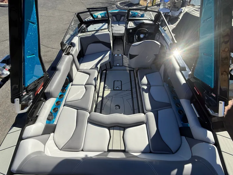 Slide: The Image of The image shows the interior of a 2026 Centurion Fe22 boat with luxurious seating. - 12