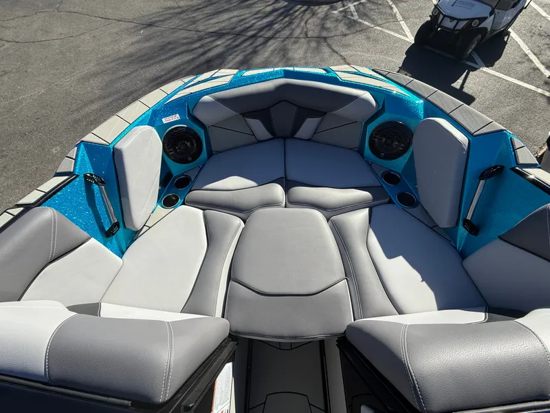 Slide: The Image of The image shows the bow of a Centurion Fe22 boat with gray and blue upholstery. - 17