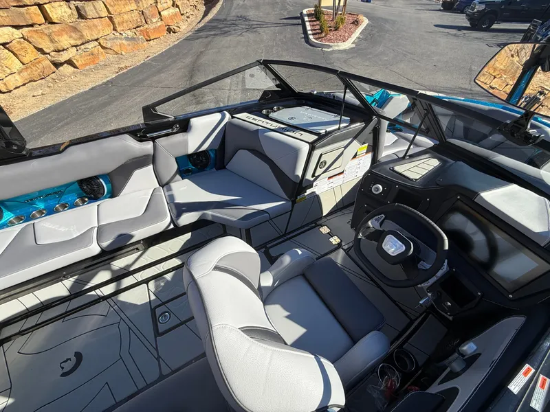 Slide: The Image of The image shows the cockpit of a 2026 Centurion Fe22 boat with modern seating and controls. - 11