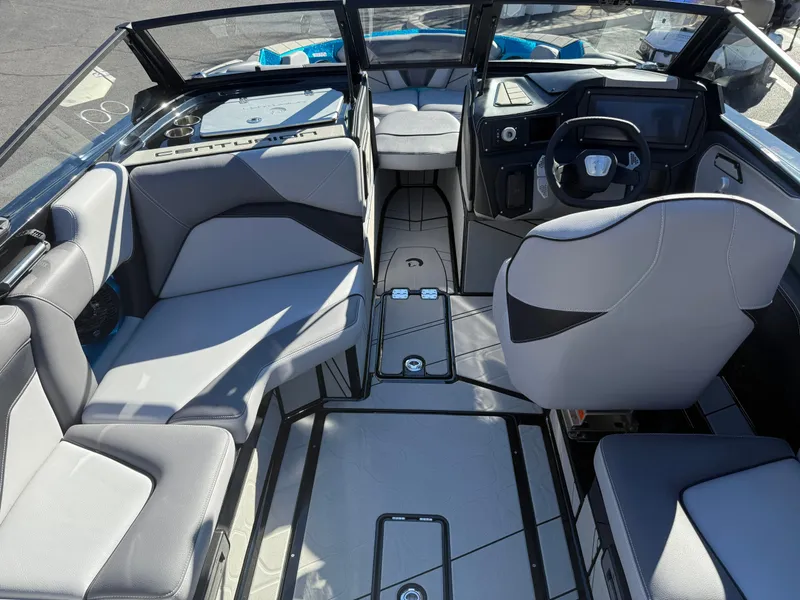 Slide: The Image of Interior of a modern motorboat with gray seating and a helm station. - 4