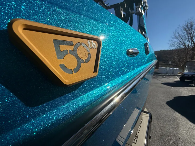 Slide: The Image of Close-up of a Centurion Fe22 boat with a 50th anniversary badge. - 14