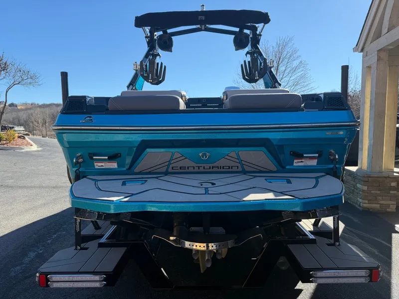 Slide: The Image of The image shows a 2026 Centurion Fe22 boat on a trailer, with a sleek design. - 8