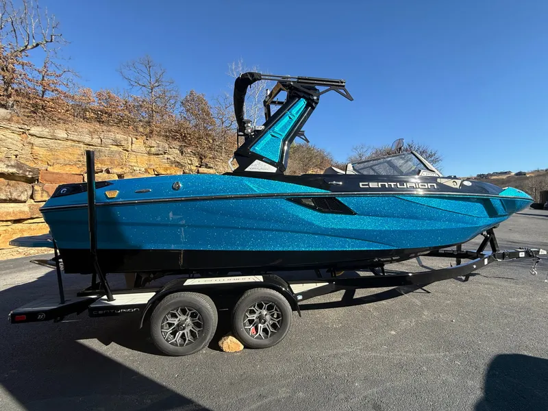 Slide: The Image of A blue 2026 Centurion Fe22 on a trailer, set against a rocky backdrop. - 7