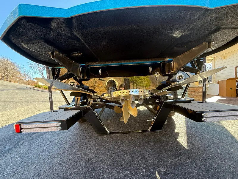 Slide: The Image of Underside of a Centurion Fe22 boat with propeller and rudder on asphalt. - 3