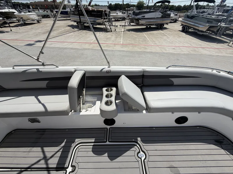 Slide: The Image of The image shows the deck of a 2018 Hurricane 201 SS boat with gray seating and cup holders. - 24