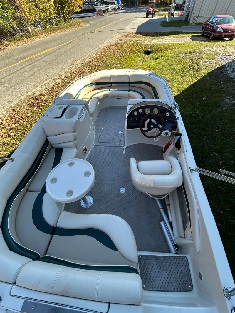 Slide: The Image of Interior view of a Bennington RL210 pontoon boat with seating and helm. - 12