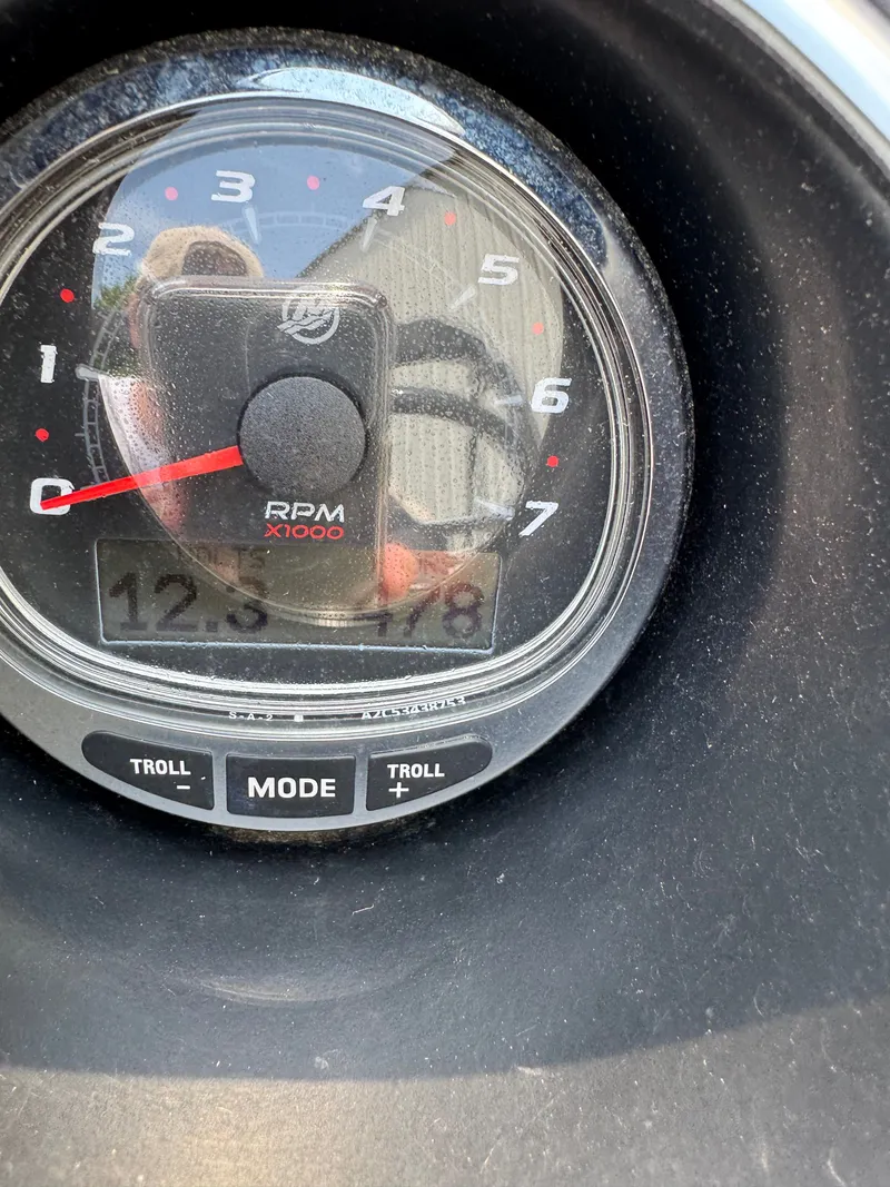 Slide: The Image of Close-up of a tachometer with digital display and control modes. - 12