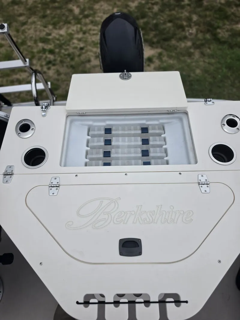 Slide: The Image of View of the stern of a Berkshire 231RF boat with storage and cup holders. - 14