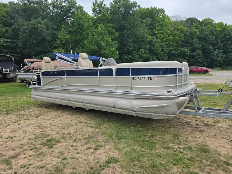 Slide: The Image of A 2012 Berkshire 231RF pontoon boat on a trailer in a grassy area. - 6