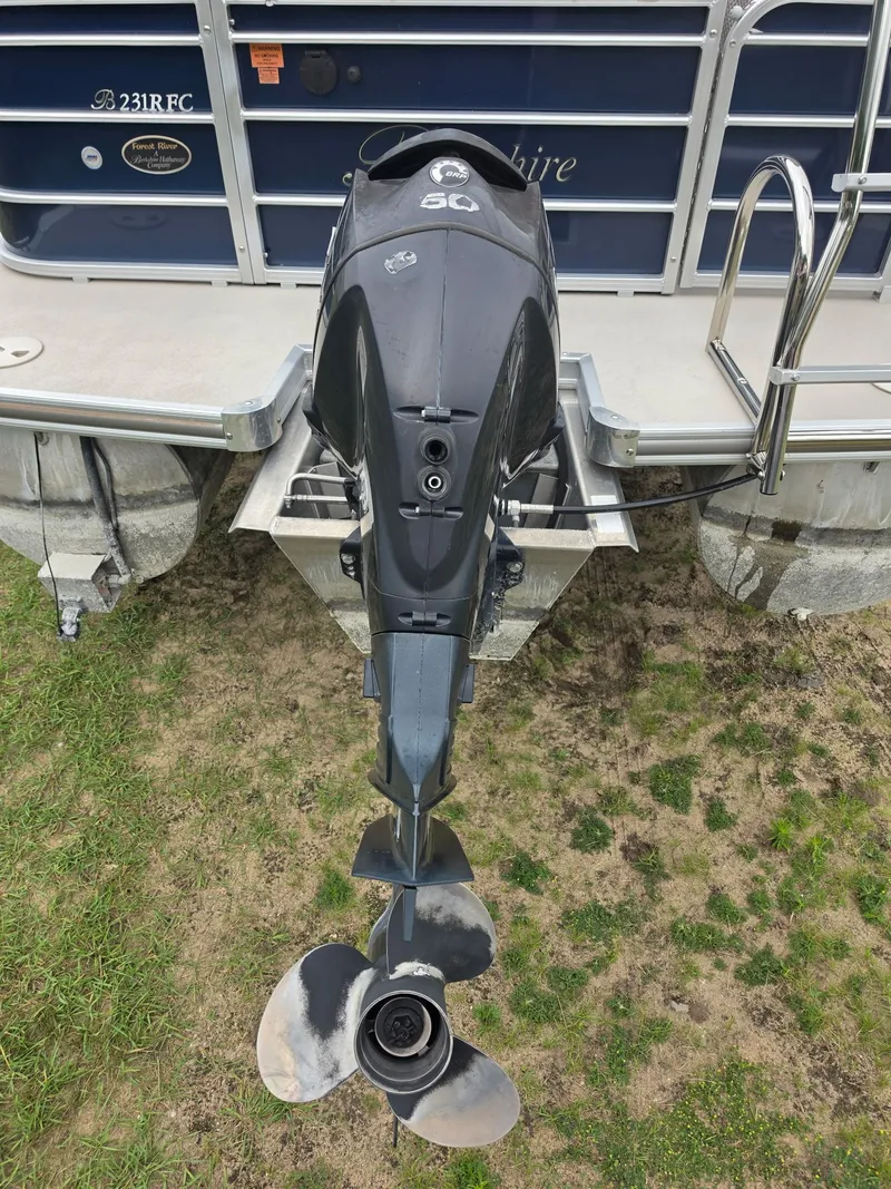 Slide: The Image of Outboard motor of a 2012 Berkshire 231RF, on a trailer on land. - 4