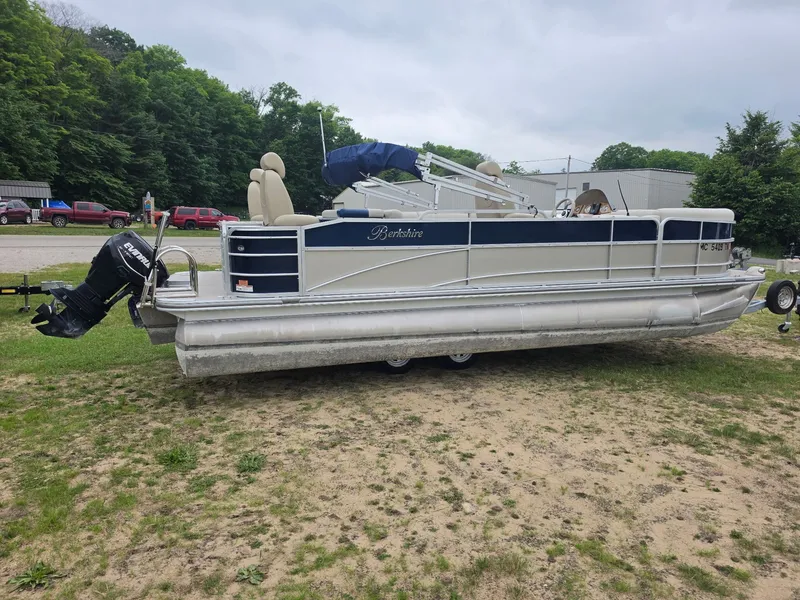 Slide: The Image of A 2012 Berkshire 231RF pontoon boat on a trailer in a grassy area. - 5