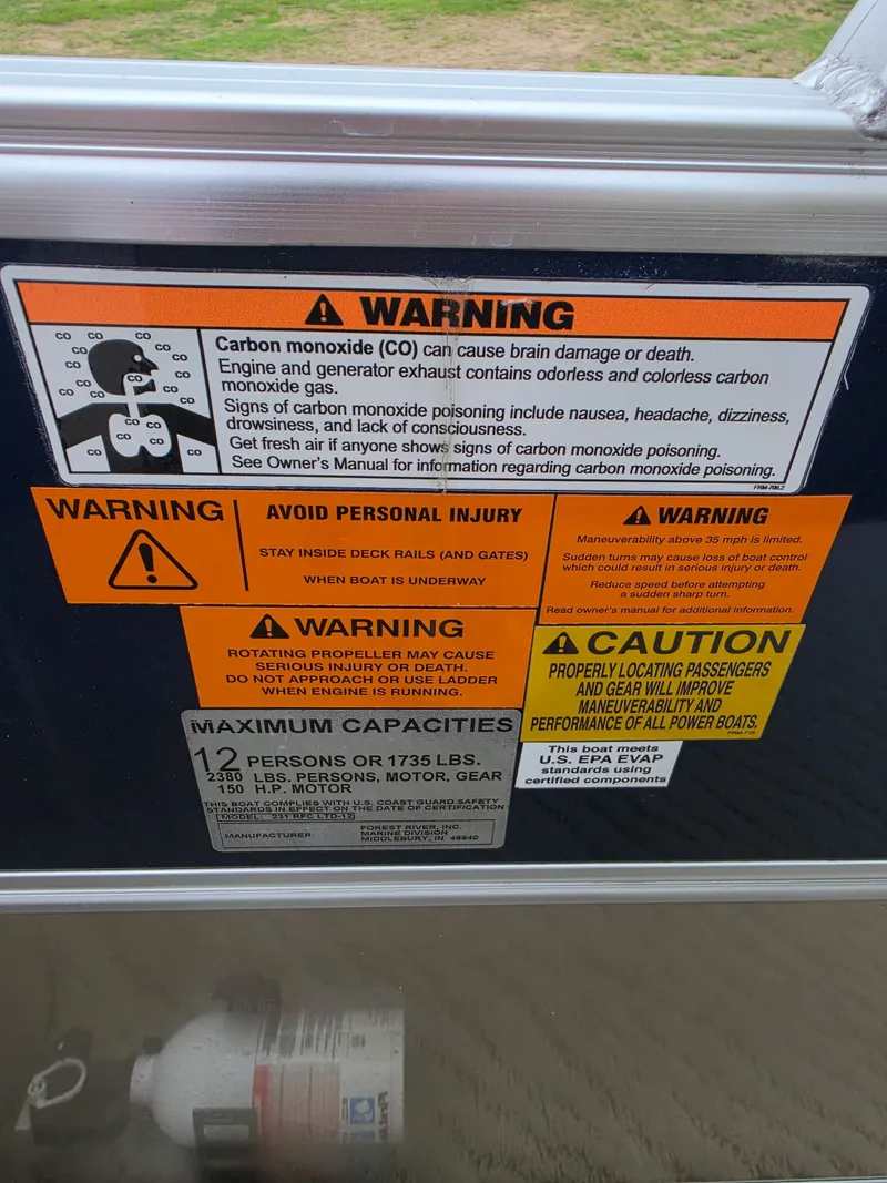 Slide: The Image of Warning labels and safety information on a boat. - 9
