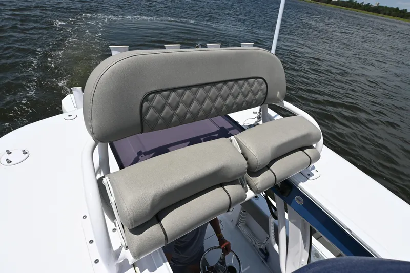 Slide: The Image of 2025 Sportsman Heritage 261 Center Console boat seat on water. - 16