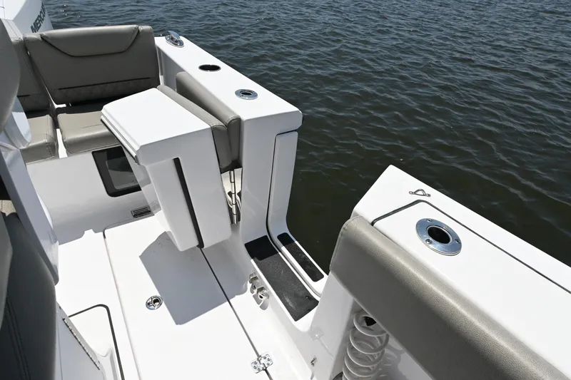Slide: The Image of 2025 Sportsman Heritage 261 Center Console boat interior with seating and rod holders. - 23