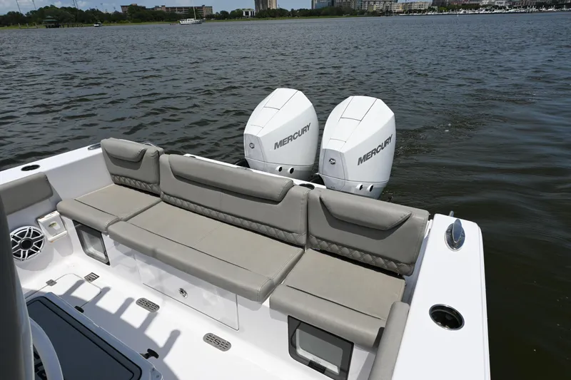 Slide: The Image of 2025 Sportsman Heritage 261 Center Console boat with dual Mercury engines on water. - 18