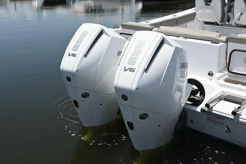 Slide: The Image of Twin V6 engines on a 2025 Sportsman Heritage 261 Center Console boat. - 25