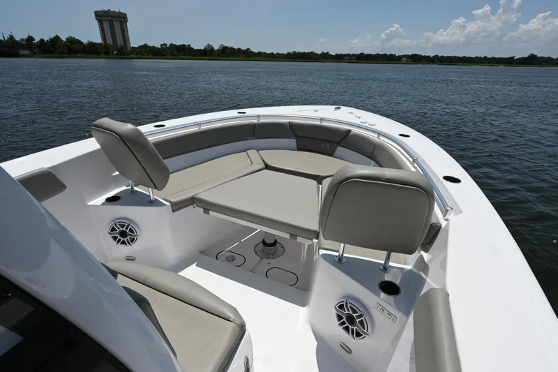Slide: The Image of 2025 Sportsman Heritage 261 Center Console boat interior on calm water. - 12