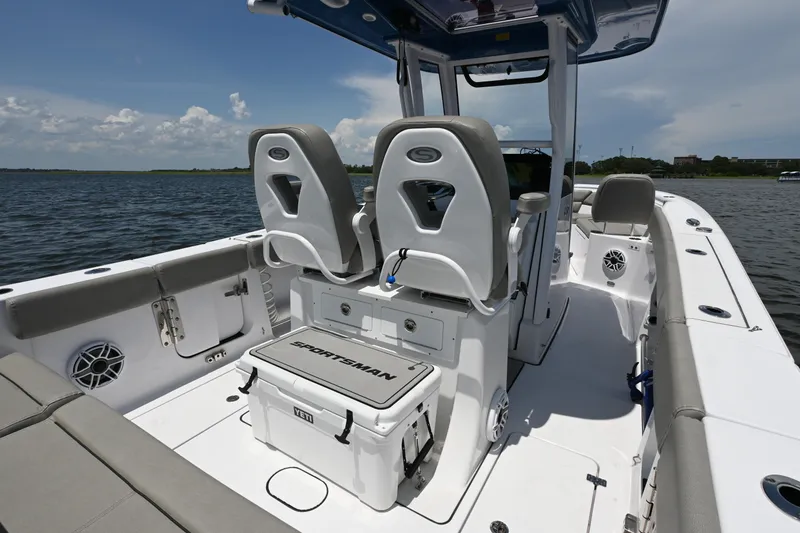 Slide: The Image of 2025 Sportsman Heritage 261 Center Console boat interior with seating and storage. - 21