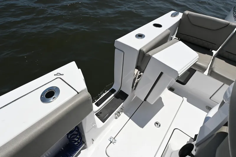 Slide: The Image of 2025 Sportsman Heritage 261 Center Console boat interior with seating and cup holders. - 24