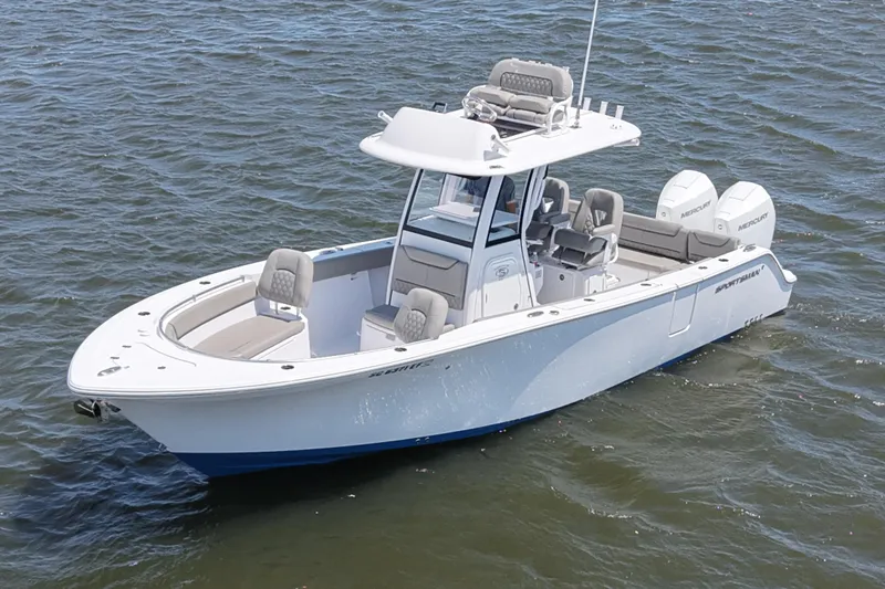 The Image of 2025 Sportsman Heritage 261 Center Console boat on water, showcasing sleek design and dual engines. - 0