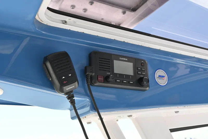 Slide: The Image of Garmin marine radio on 2025 Sportsman Heritage 261 Center Console boat. - 9