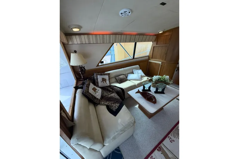 Slide: The Image of Luxurious interior of 1989 Bertram 43 Convertible yacht with elegant seating and decor. - 32