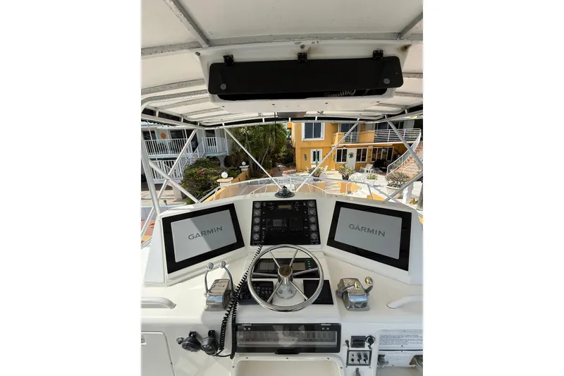 Slide: The Image of Cockpit of 1989 Bertram 43 Convertible with Garmin navigation displays. - 50