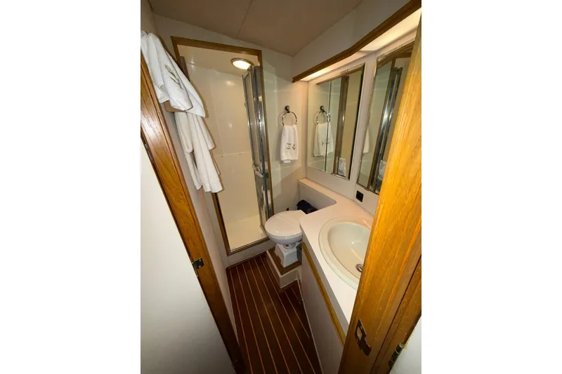 Slide: The Image of Bathroom interior of 1989 Bertram 43 Convertible yacht with shower and sink. - 45