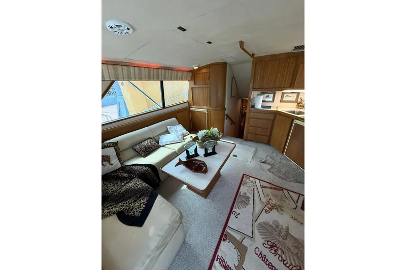 Slide: The Image of Luxurious interior of a 1989 Bertram 43 Convertible yacht with elegant furnishings. - 33