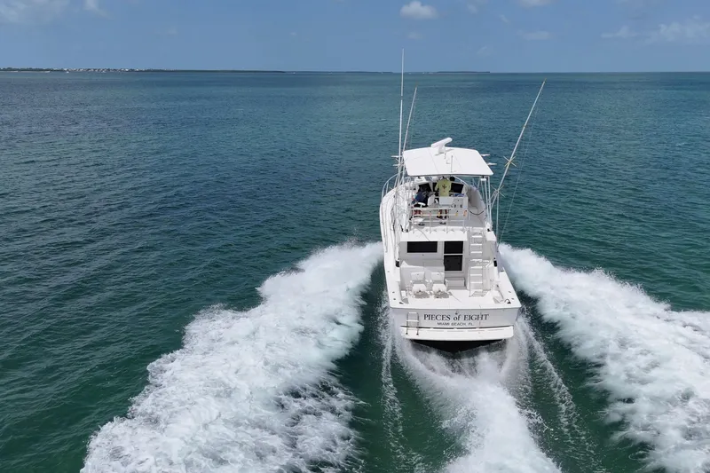 Slide: The Image of 1989 Bertram 43 Convertible yacht cruising on open ocean waters. - 3