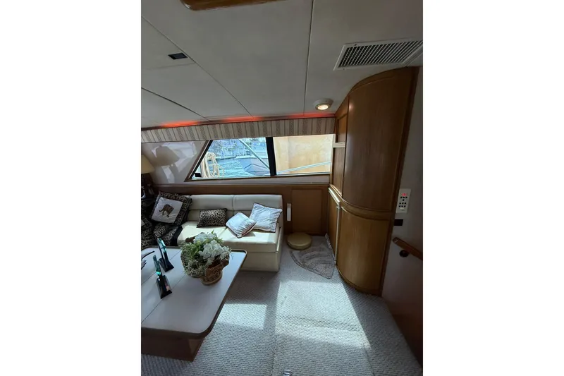 Slide: The Image of Interior of 1989 Bertram 43 Convertible yacht with cozy seating and elegant decor. - 38