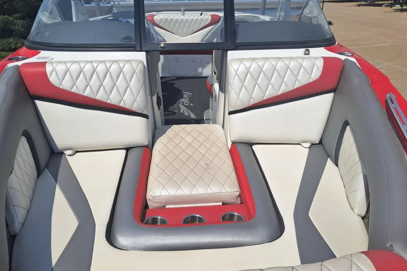 Slide: The Image of 2013 Tigé RZ2 boat interior with red and white diamond-stitched upholstery. - 6