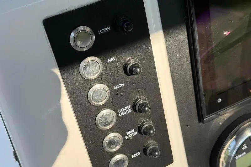 Slide: The Image of Control panel of 2022 Robalo R180 Center Console boat with labeled switches. - 16