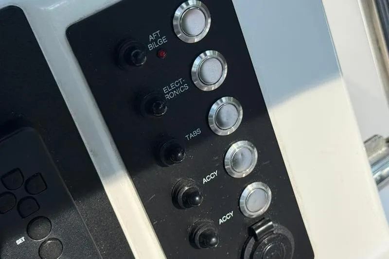 Slide: The Image of Control panel of 2022 Robalo R180 Center Console boat with labeled switches. - 20