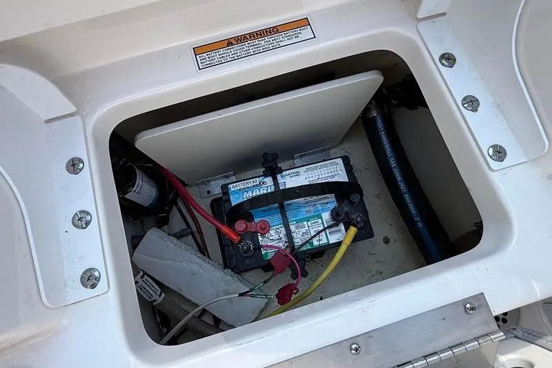 Slide: The Image of Battery compartment of 2022 Robalo R180 Center Console boat. - 11