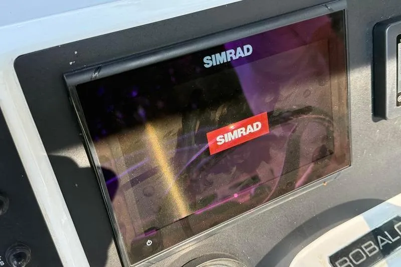 Slide: The Image of Simrad display on 2022 Robalo R180 Center Console boat dashboard. - 18