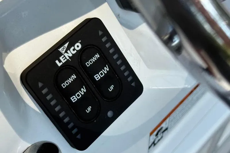 Slide: The Image of Lenco trim tab control panel on 2022 Robalo R180 Center Console boat. - 21