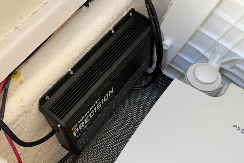 Slide: The Image of Minn Kota Precision charger in 2022 Robalo R180 Center Console boat. - 27