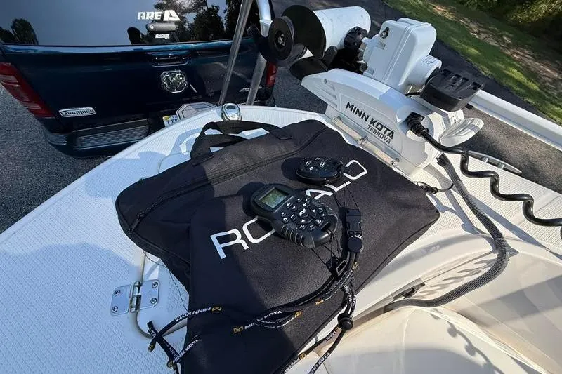 Slide: The Image of 2022 Robalo R180 Center Console boat with Minn Kota trolling motor and accessories. - 24