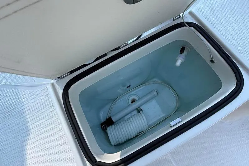 Slide: The Image of Open storage compartment on 2022 Robalo R180 Center Console boat. - 10