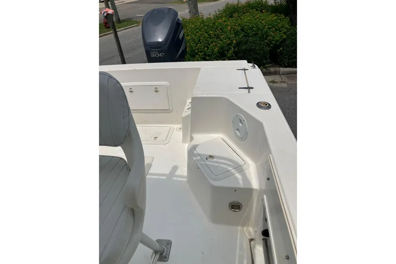 Slide: The Image of 2003 Seapro 239 boat interior with seating and storage compartments, featuring a Yamaha 30C outboard motor. - 12
