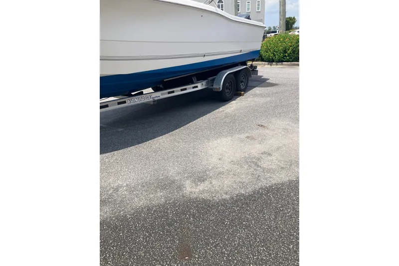Slide: The Image of 2003 Seapro 239 boat on trailer in parking lot. - 18