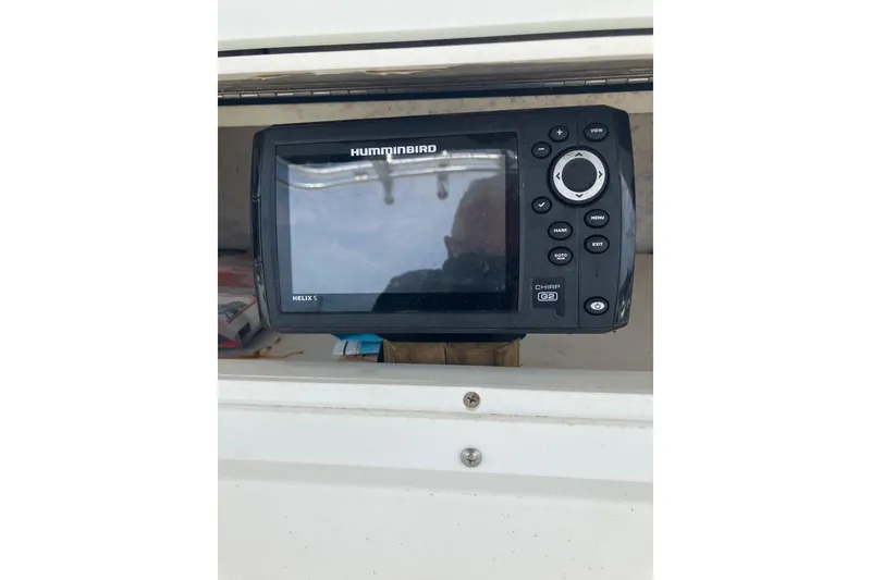 Slide: The Image of Humminbird Helix 5 fish finder on a 2003 Seapro 239 boat dashboard. - 10