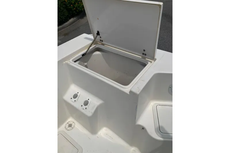 Slide: The Image of Open storage compartment on a 2003 Seapro 239 boat deck. - 19
