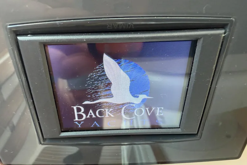 Slide: The Image of Display screen showing Back Cove Yachts logo on a 2024 Back Cove 372. - 48