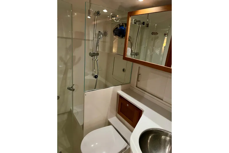 Slide: The Image of Luxurious bathroom in 2024 Back Cove 372 yacht with modern fixtures and glass shower. - 28