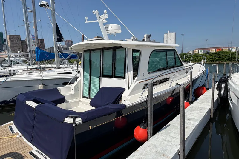 Slide: The Image of 2024 Back Cove 372 yacht docked at marina, featuring sleek design and modern amenities. - 80