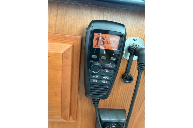 Slide: The Image of VHF radio on 2024 Back Cove 372 boat, mounted on wooden panel. - 50